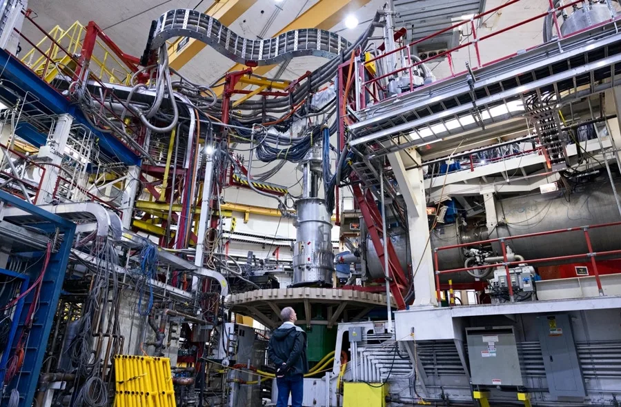 Industrial electrical and mechanical infrastructure inside a large technical facility.